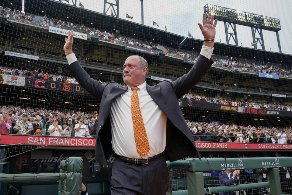 Former San Francisco Giants player Will Clark salutes the crowd as he is introduced for the ceremony to retire his jersey No. 22 before a baseball game between the Giants and the Chicago Cubs in San Francisco, Saturday, July 30, 2022. (AP Photo/Godofredo A. Vásquez)