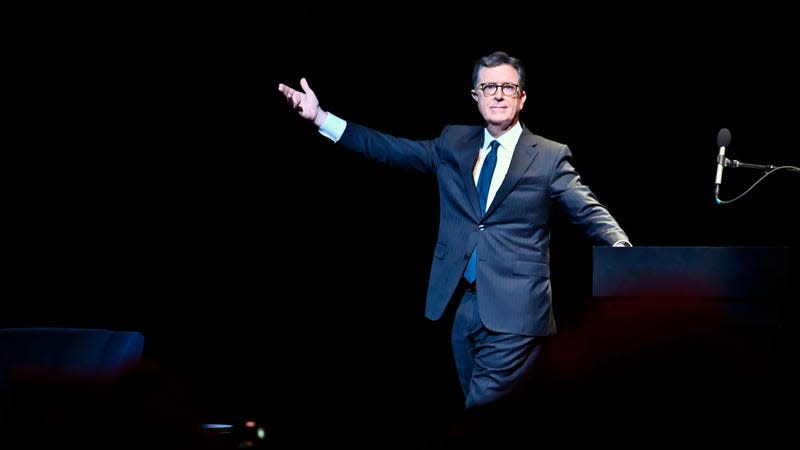 Stephen Colbert making a dramatic entrance onstage