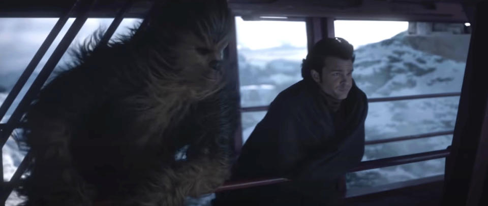 Chewbacca and Han Solo in "Star Wars" peek out of the Millennium Falcon's cockpit