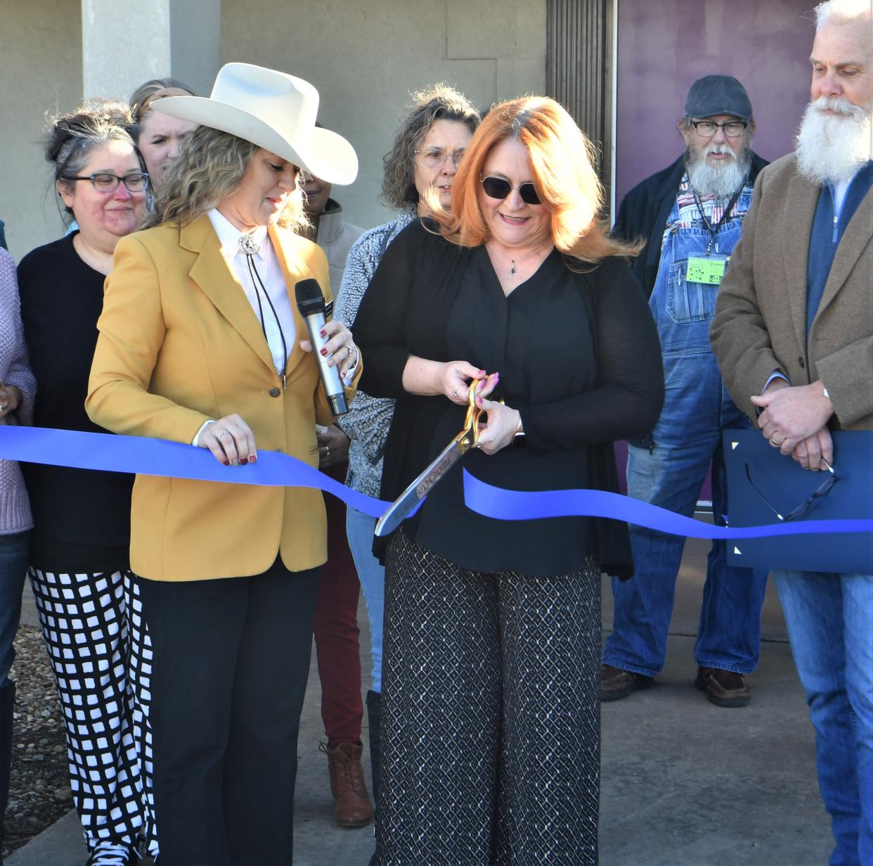 VITA Program Director Genevieve Anderson cuts the ribbon during the VITA Site and EITC Awareness Day event on Friday, January 2, 2023 at the VITA site, at 3301 Armory Rd., behind the Boys & Girls Club in Wichita Falls.
