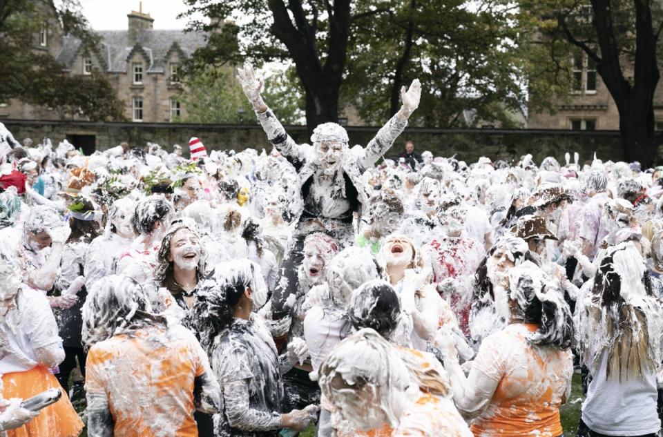 Students take part in the traditional Raisin Monday foam fight at St Andrews (Jane Barlow/PA) (PA Archive)