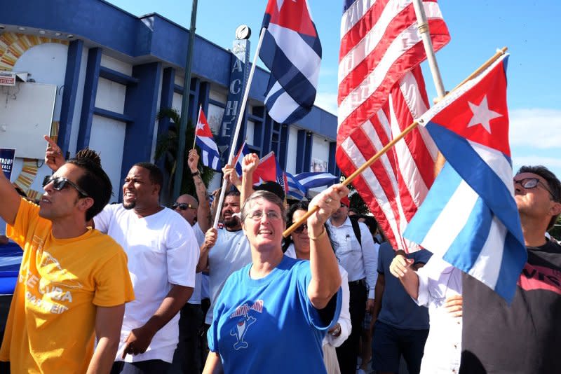 Cuban-Americans gather in Little Havana in Miami on November 26, 2016. On November 6, 1965, a formal agreement between the United States and Cuba allows Cubans who wanted to leave the island nation for America to do so. File Photo by Gary I Rothstein/UPI