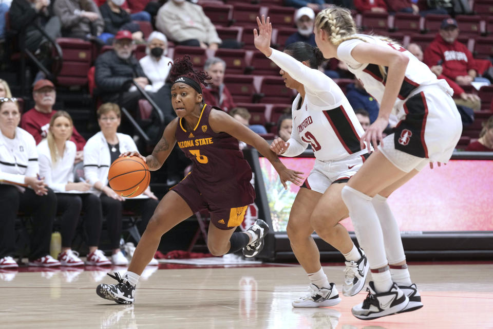 Arizona State guard Tyi Skinner (3) drives against Stanford guard Talana Lepolo, middle, and forward Cameron Brink during the first half of an NCAA college basketball game Saturday, Dec. 31, 2022, in Stanford, Calif. (AP Photo/Darren Yamashita)