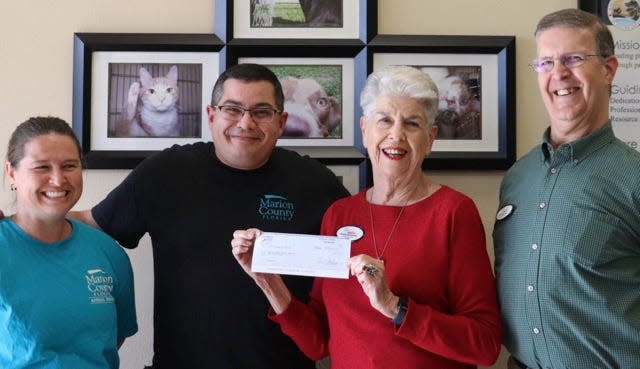 The Senior Resource Foundation of Ocala presented a $4,000 check to Marion County Animal Services. From left: Julie Stinson, Marion County Animal Services; James Sweet, Marion County Animal Services; Phyllis Silverman, president and founder of the Senior Resource Foundation of Ocala; and Herb Silverman, marketing and webmaster for the Senior Resource Foundation of Ocala.