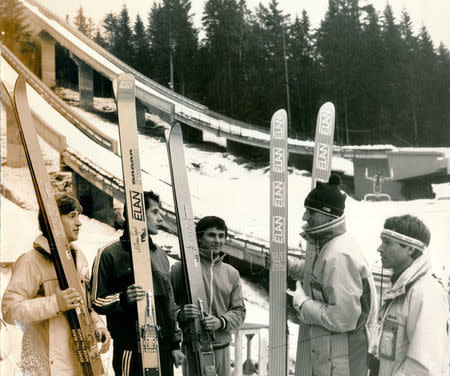 The Yugoslavia ski jump team stands in front of ski jumps on mountain Igman during the winter Olympics in Sarajevo in 1984. Oslobodjenje/via REUTERS