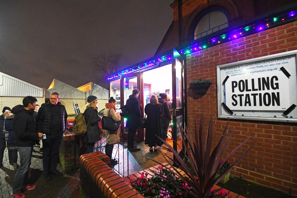 Voters queue outside St Andrews Church polling station in Balham, south London, just hours before voting closes for the 2019 General Election.