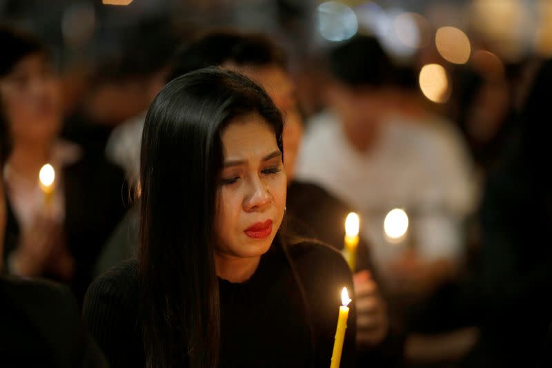 People pray for victims who died in a mass shooting at Terminal 21 shopping mall in Nakhon Ratchasima