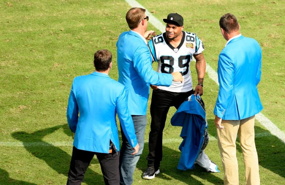 Steve Smith smiles after taking off his Panthers blue blazer to reveal his No. 89 jersey underneath during Carolina’s Hall of Honor ceremony in October. Smith was inducted along with Jake Delhomme, the quarterback he said he “grew up with” as a Panther.