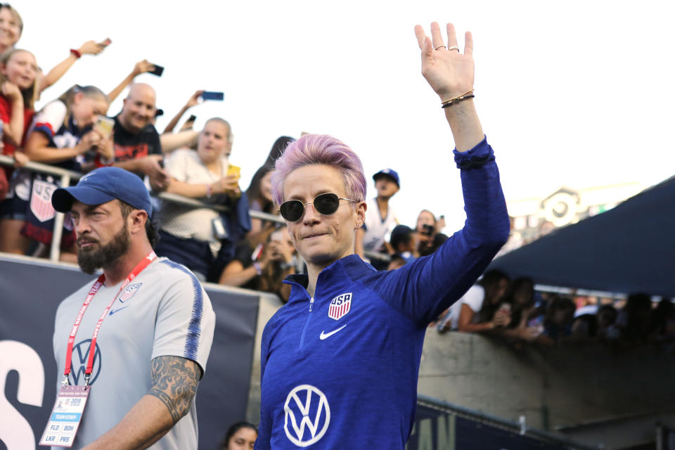 PASADENA, CALIFORNIA - AUGUST 03:    Megan Rapinoe #15 of United States waves to fans as she takes the field ahead of the first game of the USWNT Victory Tour against Republic of Ireland  at Rose Bowl on August 03, 2019 in Pasadena, California. (Photo by Katharine Lotze/Getty Images)