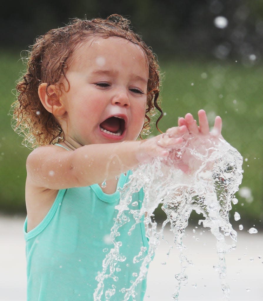 Zara Tinajero, 2, enjoys the water park at Veterans Park in Lehigh Acres on Tuesday May, 14, 2019. Temperatures were hovering in the mid 80's. 