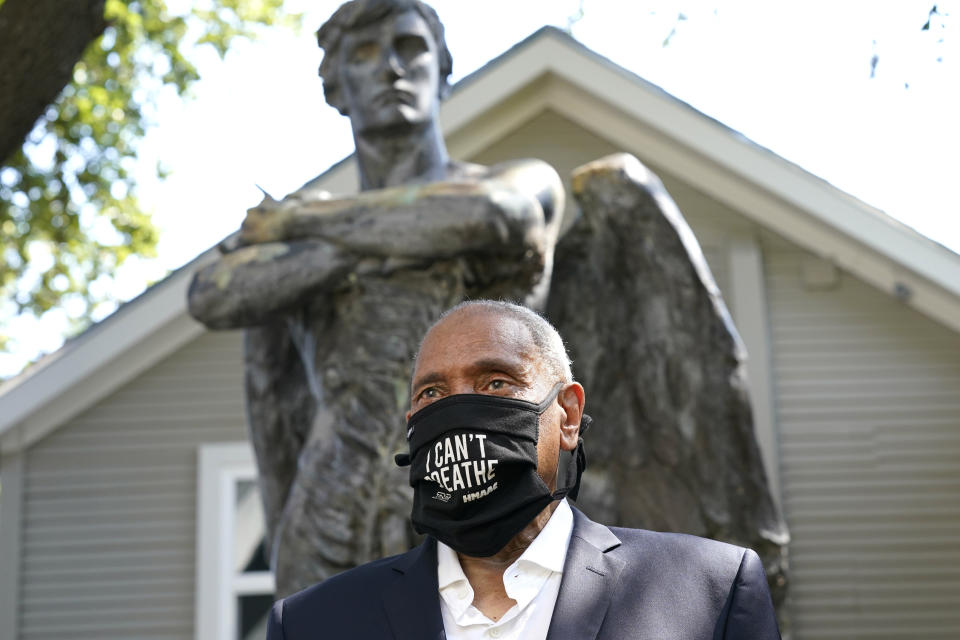 John Guess, Jr., CEO Emeritus of The Houston Museum of African American Culture, talks about the bronze statue "The Spirit of The Confederacy" on display at the museum, Tuesday, Aug. 18, 2020, in Houston. The statue was removed from a downtown Houston park in June following a recommendation more than two years earlier by a task force established by Mayor Sylvester Turner. The statue, which had been in storage since its removal, arrived at the Houston Museum of African American Culture on Monday. (AP Photo/David J. Phillip)