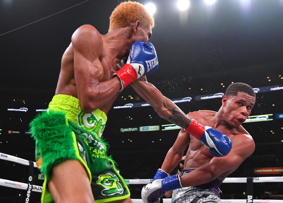 LOS ANGELES, CA - NOVEMBER 09: Devan Haney (silver shorts) and Alfredo Santiago-Alvarez (green shorts) exchange punches during their WBC World Lightweight Championship fight at Staples Center on November 9, 2019 in Los Angeles, California. Haney won by unanimous decision. (Photo by Jayne Kamin-Oncea/Getty Images)