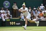 Jarkko Nieminen of Finland hits a shot during his match against Novak Djokovic of Serbia at the Wimbledon Tennis Championships in London, July 1, 2015. REUTERS/Toby Melville