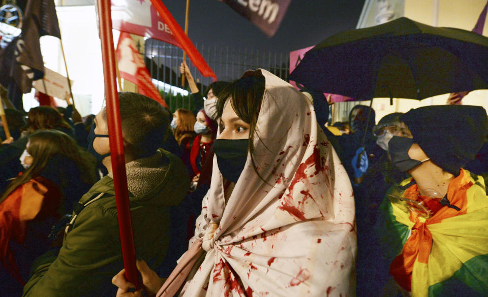 People protest against imposing further restrictions on abortion law in front of the Warsaw Curia in Warsaw, Poland, Sunday, Oct. 25, 2020. (AP Photo/Czarek Sokolowski)