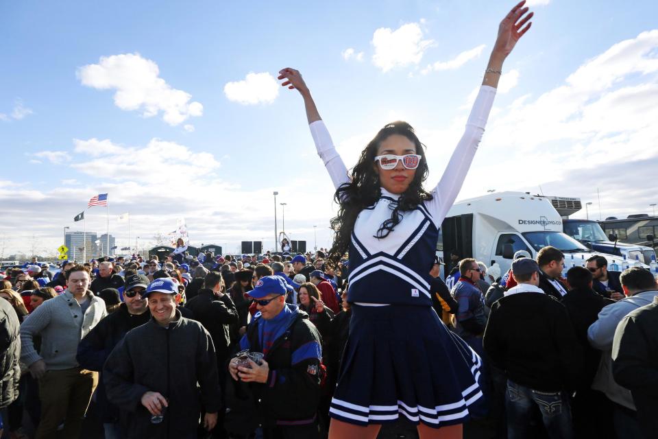 A woman dances during an event called "The Tailgate with Cause" to raise money for people suffering from the affects of Superstorm Sandy and cystic fibrosis as fans tailgate before an NFL football game between the New York Giants and the Pittsburgh Steelers, Sunday, Nov. 4, 2012, in East Rutherford, N.J. (AP Photo/Julio Cortez)