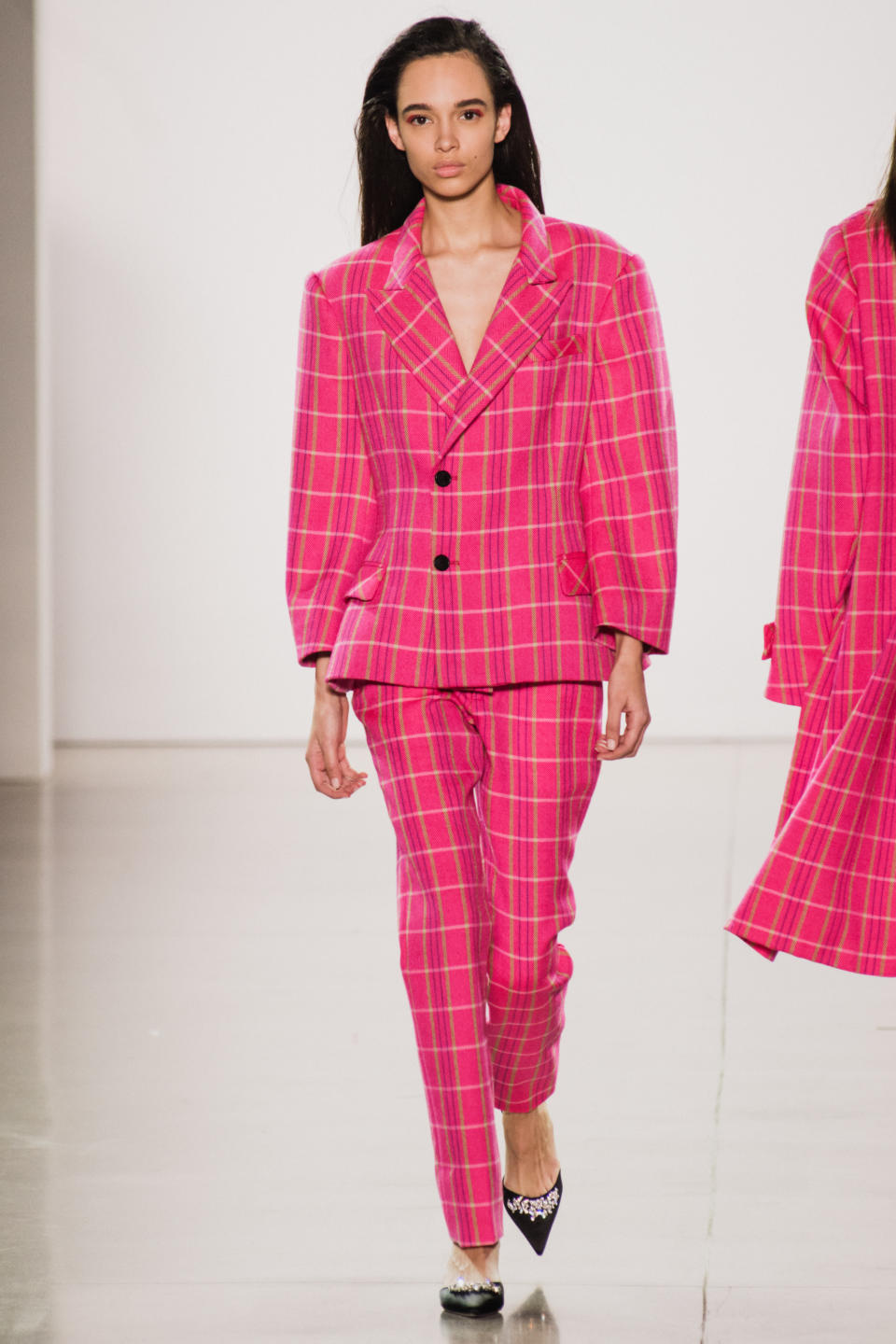 <p>Model wears a hot pink plaid suit at the fall 2018 Matthew Adams Dolan show.(Photo: Getty Images) </p>