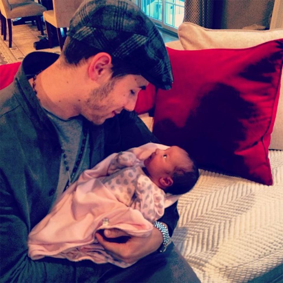 He caught that love bug again! Look at the way Nick Jonas looked at his "beautiful niece Alena Rose!" 