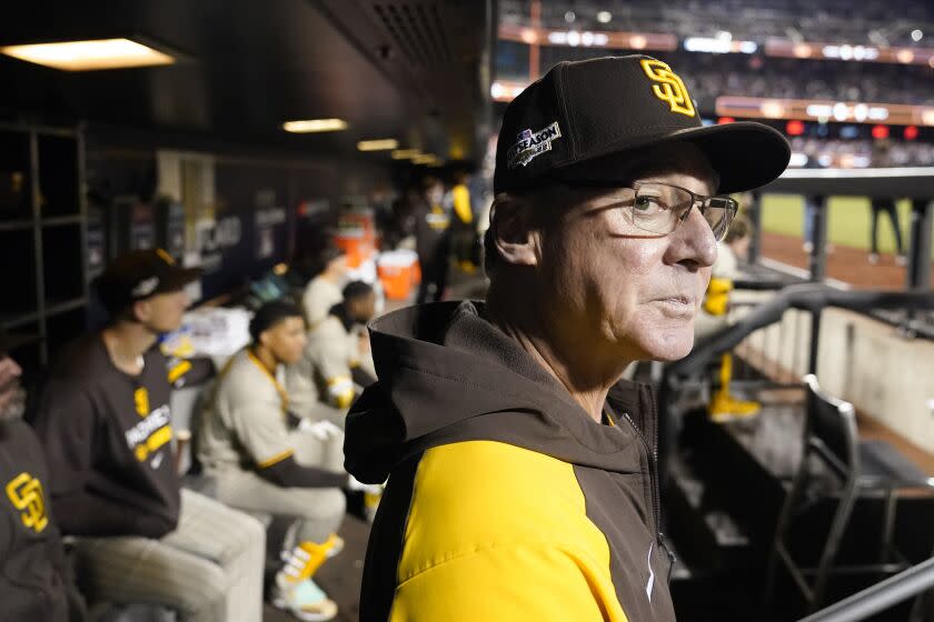 San Diego Padres manager Bob Melvin watches from the dugout before Game 3 of a National League.