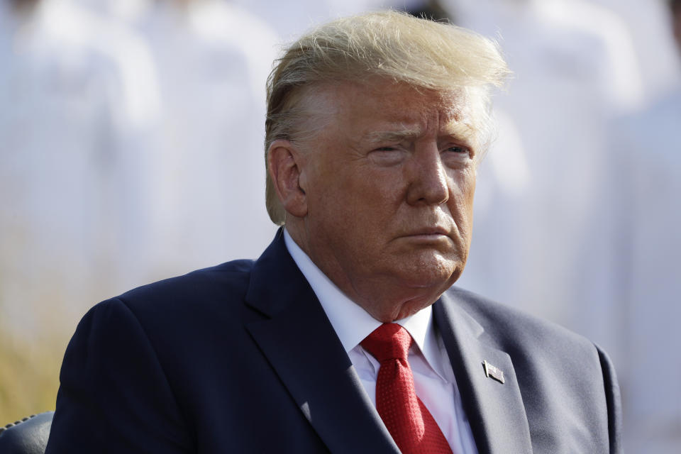 President Donald Trump listens to the program before speaking during a ceremony honoring the victims of the Sept. 11 terrorist attacks, Wednesday, Sept. 11, 2019, at the Pentagon. (AP Photo/Evan Vucci)