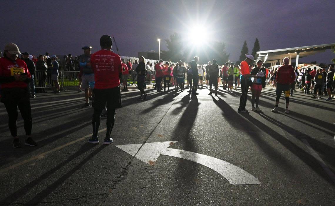 Runners gather before dawn at the annual Two Cities Marathon, which started and finished at the Clovis Community College campus Sunday, Nov. 6, 2022, in Clovis.