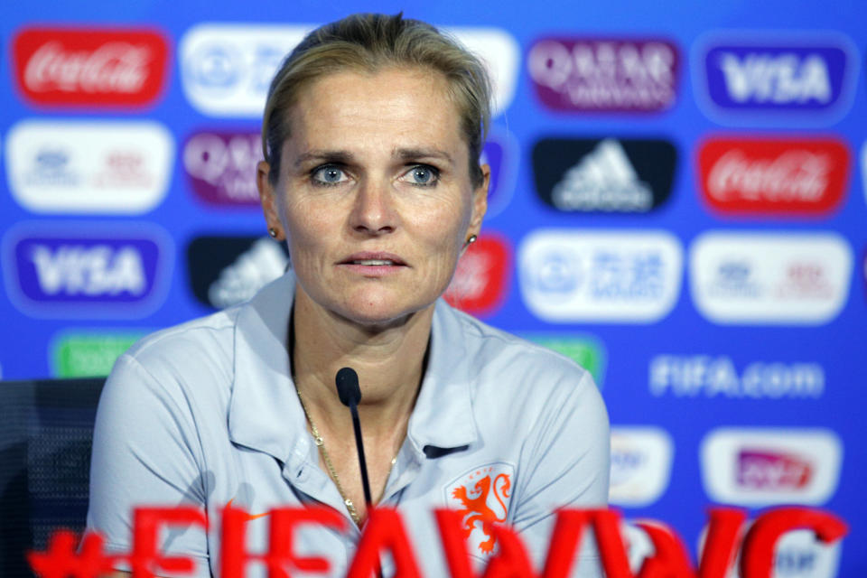 FILE - In this Saturday, July 6, 2019 file photo, Netherlands' head coach Sarina Wiegman attends a press conference at the Stade de Lyon, outside Lyon, France. England’s soccer leadership has a couple of priorities for the women’s teams. Most pressing is deciding on a coach for the Olympics next month and whether Phil Neville should lead the British team in Japan. Then there’s an expectation that Neville’s England successor, Sarina Wiegman, wins the European Championship in 2022 or the World Cup a year later. (AP Photo/Francois Mori, file)