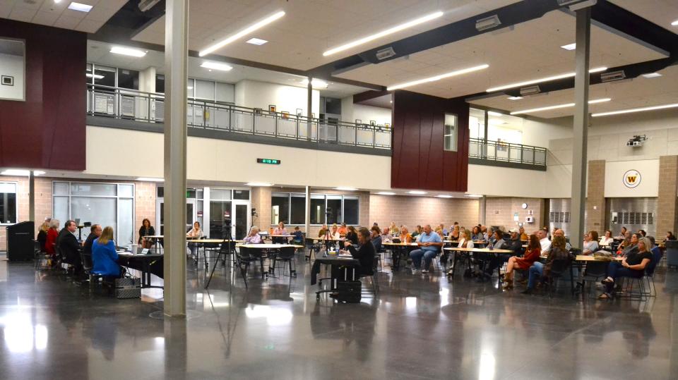 Community members listen to candidates for the Weld RE-4 School District Board of Education share their views at a "Meet the Candidates Night" on Tuesday at Windsor High School.