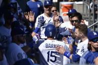 Sep 23, 2018; Los Angeles, CA, USA; Los Angeles Dodgers catcher Austin Barnes (15) celebrates with the dugout after hitting a two-run home run during the fourth inning against the San Diego Padres at Dodger Stadium. Mandatory Credit: Kelvin Kuo-USA TODAY Sports