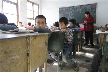 Students attend class at Pengying School on the outskirts of Beijing November 11, 2013. REUTERS/Jason Lee