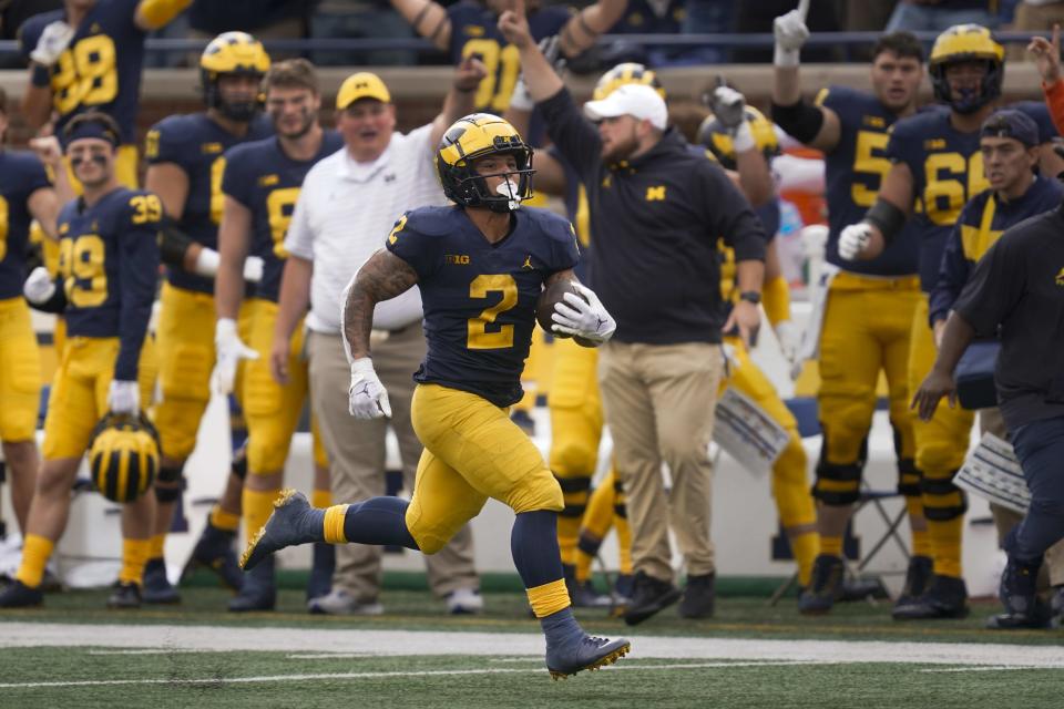 Michigan running back Blake Corum (2) runs for a 42-yard touchdown against Maryland in the second half of an NCAA college football game in Ann Arbor, Mich., Saturday, Sept. 24, 2022. (AP Photo/Paul Sancya)