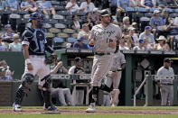 Chicago White Sox's AJ Pollock runs home to score on a single by Adam Engel during the seventh inning of a baseball game against the Kansas City Royals Thursday, May 19, 2022, in Kansas City, Mo. (AP Photo/Charlie Riedel)