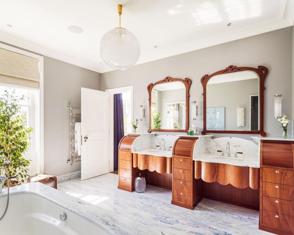 Modern bathroom with wood vanity storage unit