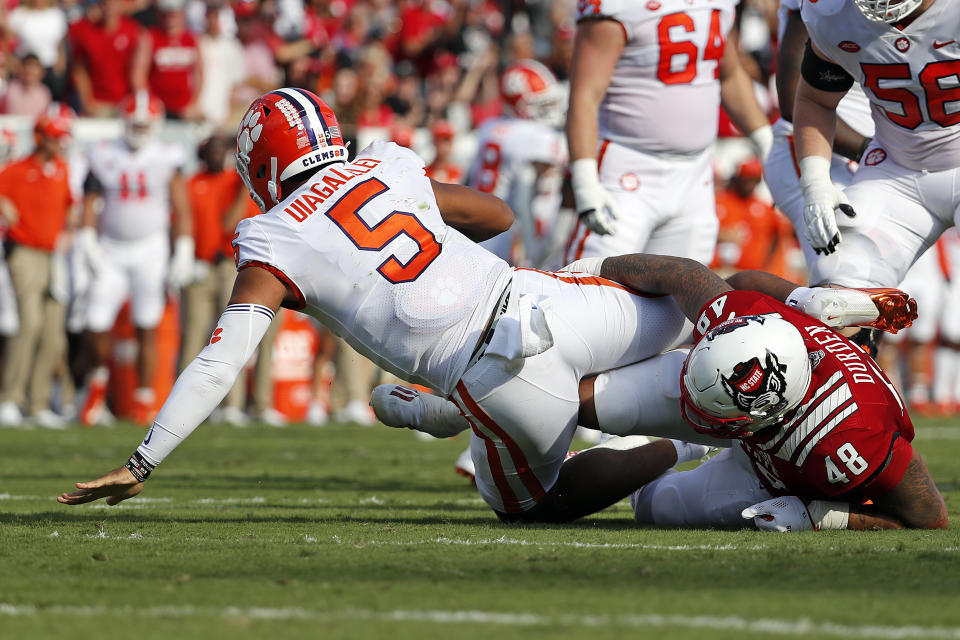 North Carolina State's Cory Durden (48) sacks Clemson's D.J. Uiagalelei (5) during the first half of an NCAA college football game in Raleigh, N.C., Saturday, Sept. 25, 2021. (AP Photo/Karl B DeBlaker)