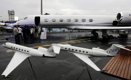 FILE PHOTO: People line up to visit the Gulfstream G550 aircraft during the Latin American Business Aviation Conference & Exhibition fair (LABACE) at Congonhas airport in Sao Paulo, Brazil August 15, 2017. REUTERS/Paulo Whitaker/File Photo