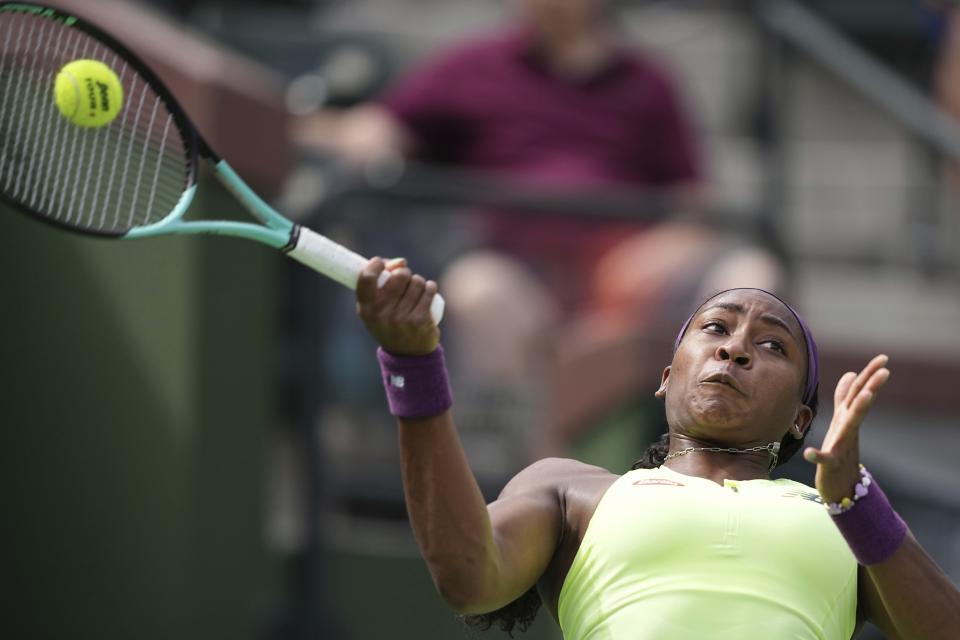 Coco Gauff, of the United States, returns a shot to Lucia Bronzetti, of Italy, at the BNP Paribas Open tennis tournament Monday, March 11, 2024, in Indian Wells, Calif. (AP Photo/Mark J. Terrill)