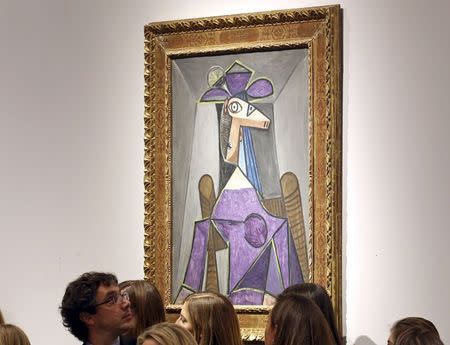 An artwork titled "Portrait de femme (Dora Maar)" by artist Pablo Picasso is seen during a Christie's auction in New York May 6, 2014. REUTERS/Adam Hunger