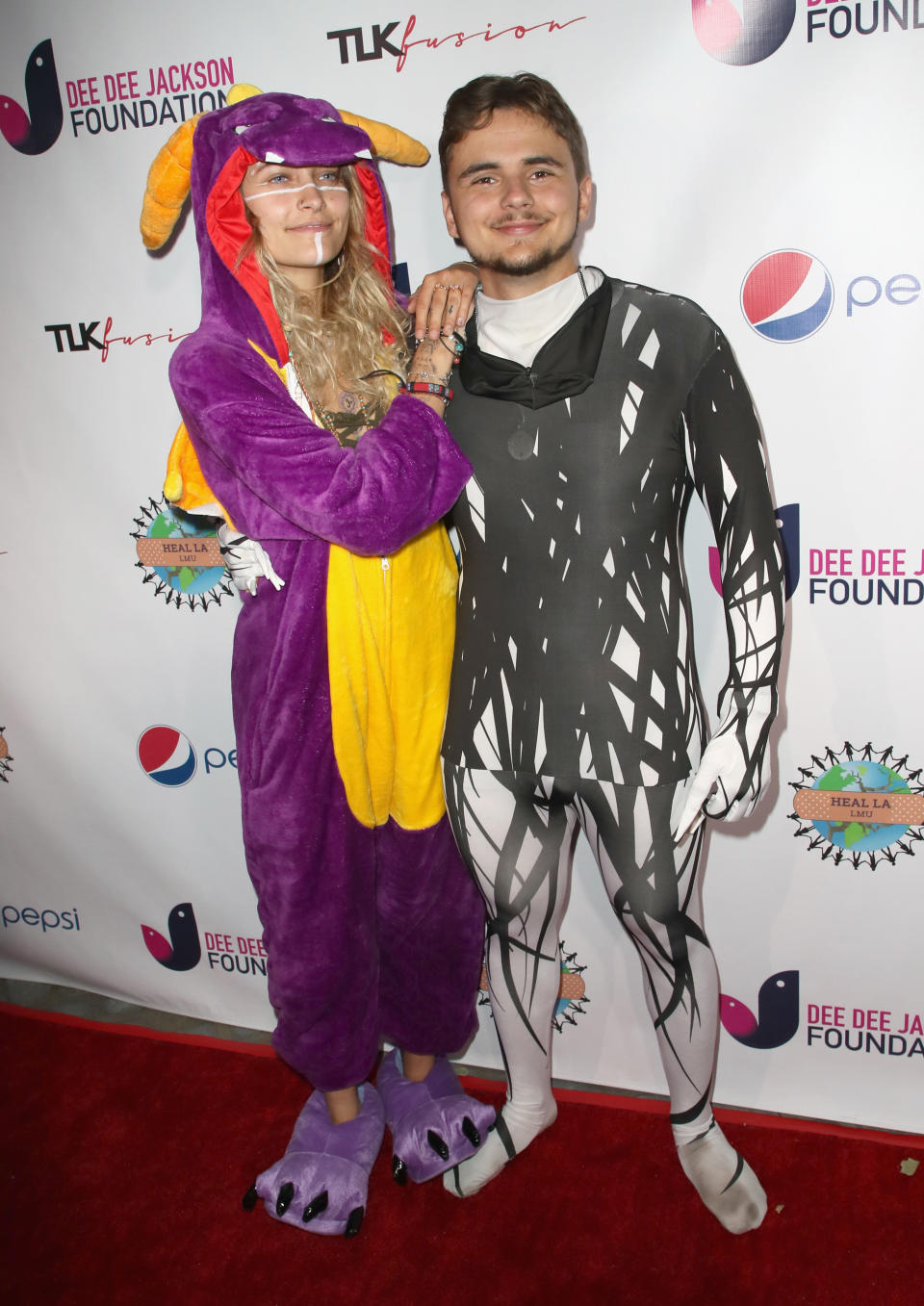 The adorable siblings dressed in onsies for a benefit at their family home over the weekend.