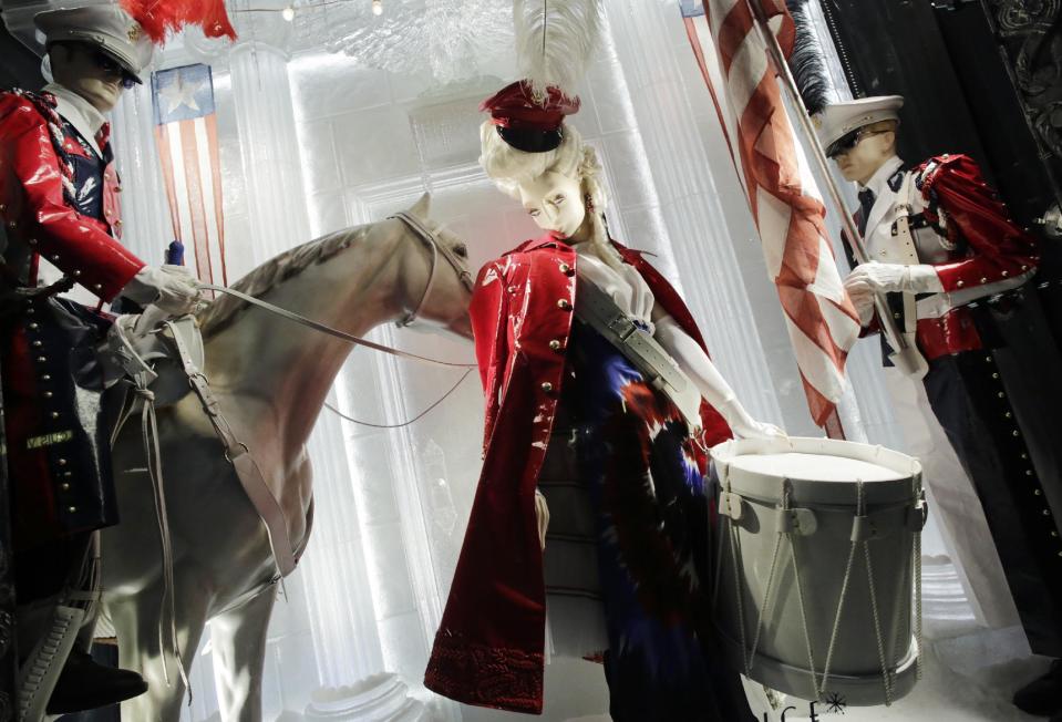 This Nov. 20, 2013 photo shows a display celebrating the Fourth of July in a holiday window at Bergdorf Goodman in New York. Forget window shopping, some of Manhattan’s biggest and most storied retailers say their elaborate seasonal window displays are a gift to passers-by. (AP Photo/Mark Lennihan)