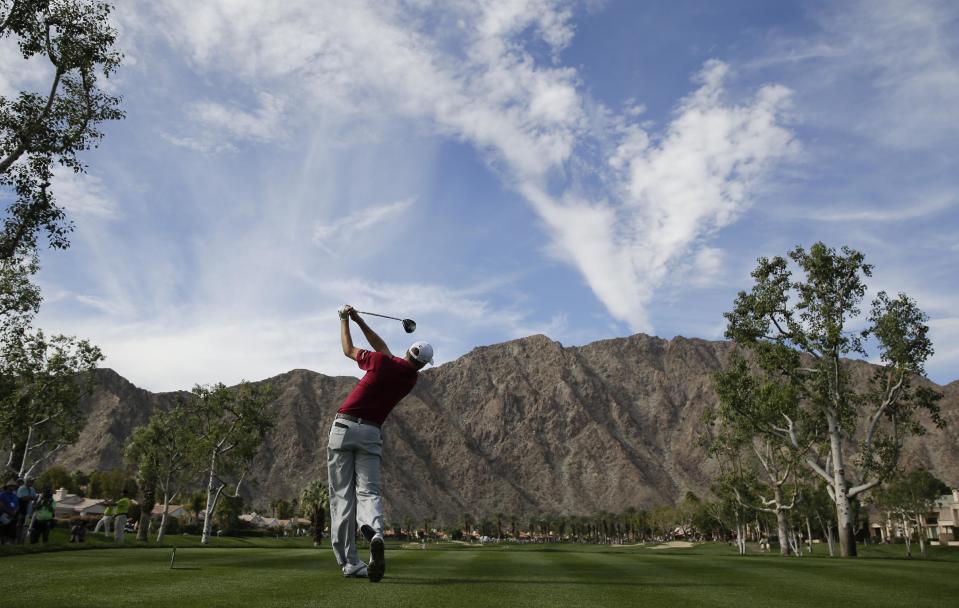 Patrick Reed hits his tee shot on fourth hole during the final round of the Humana Challenge golf tournament on the Palmer Private course at PGA West, Sunday, Jan. 19, 2014, in La Quinta, Calif. (AP Photo/Chris Carlson)