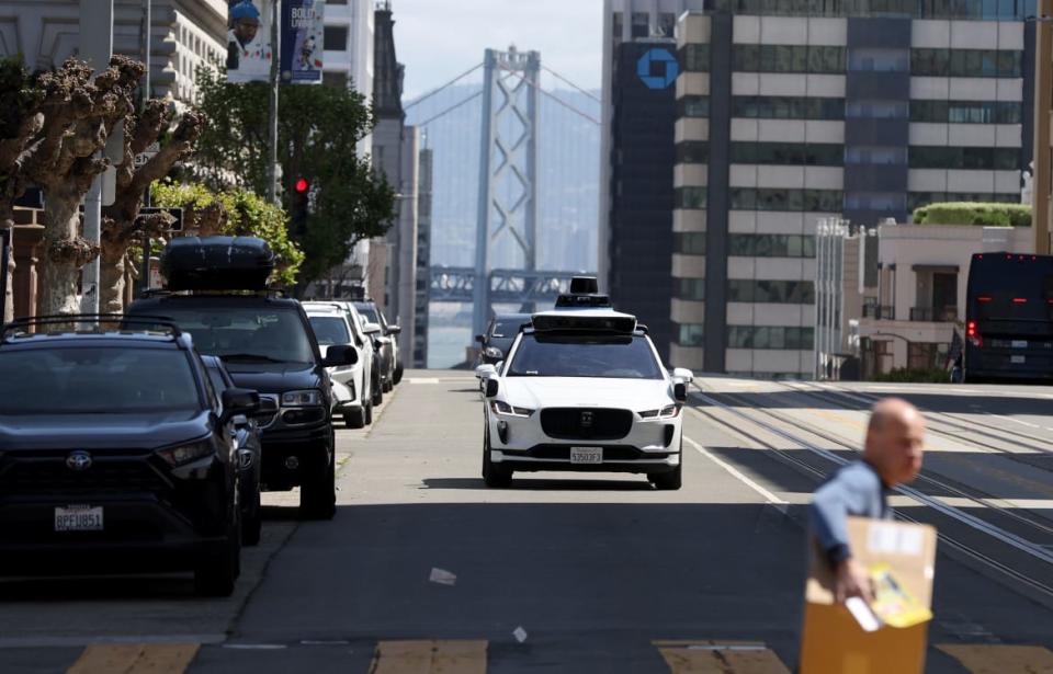 <div class="inline-image__caption"><p>A Waymo autonomous vehicle drives along California Street on April 11, 2022, in San Francisco, California.</p></div> <div class="inline-image__credit">Justin Sullivan/Getty</div>