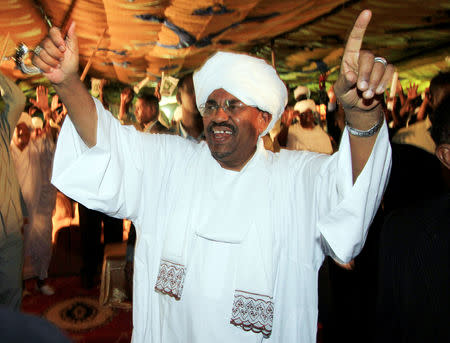 FILE PHOTO: Sudan's President Omar Hassan al-Bashir waves to supporters at the NCP Headquarters in Khartoum, Sudan April 26, 2010. REUTERS/Mohamed Nureldin/File Photo