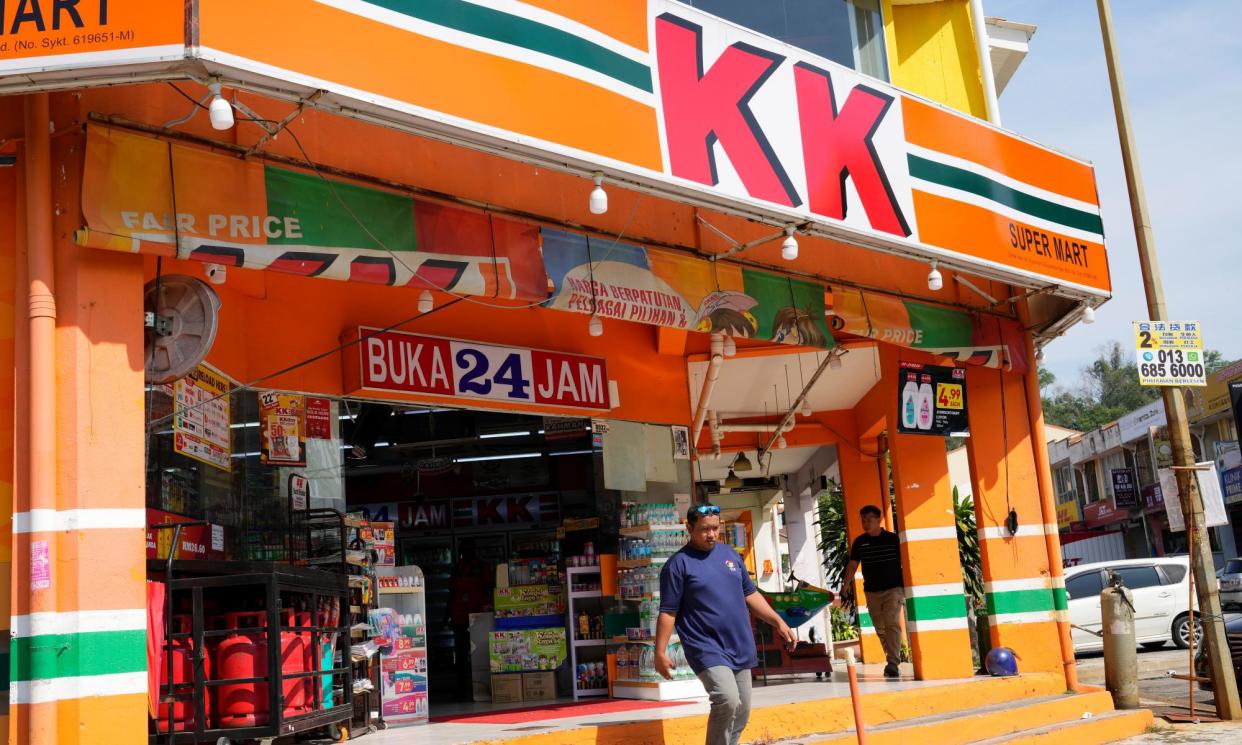 <span>KK Super Mart is Malaysia’s second-largest chain of convenience stores.</span><span>Photograph: Vincent Thian/AP</span>