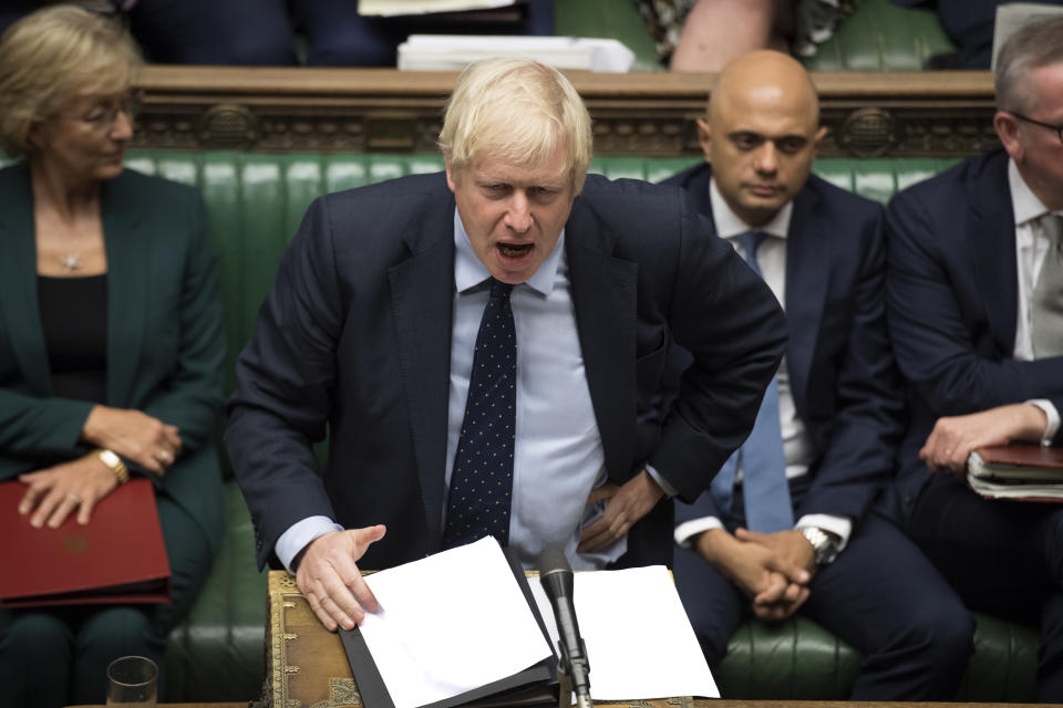 In this image released by the House of Commons, Britain's Prime Minister Boris Johnson speaks in the House of Commons, London, Tuesday Sept. 3, 2019. British Prime Minister Boris Johnson suffered key defections from his party Tuesday, losing a working majority in Parliament and weakening his position as he tried to prevent lawmakers from blocking his Brexit plans. (Jessica Taylor/House of Commons via AP)