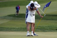 Jin Young Ko, of South Korea, hugs her caddy, David Brooker, after winning the LPGA Cognizant Founders Cup golf tournament in a playoff, Sunday, May 14, 2023, in Clifton, N.J. (AP Photo/Seth Wenig)
