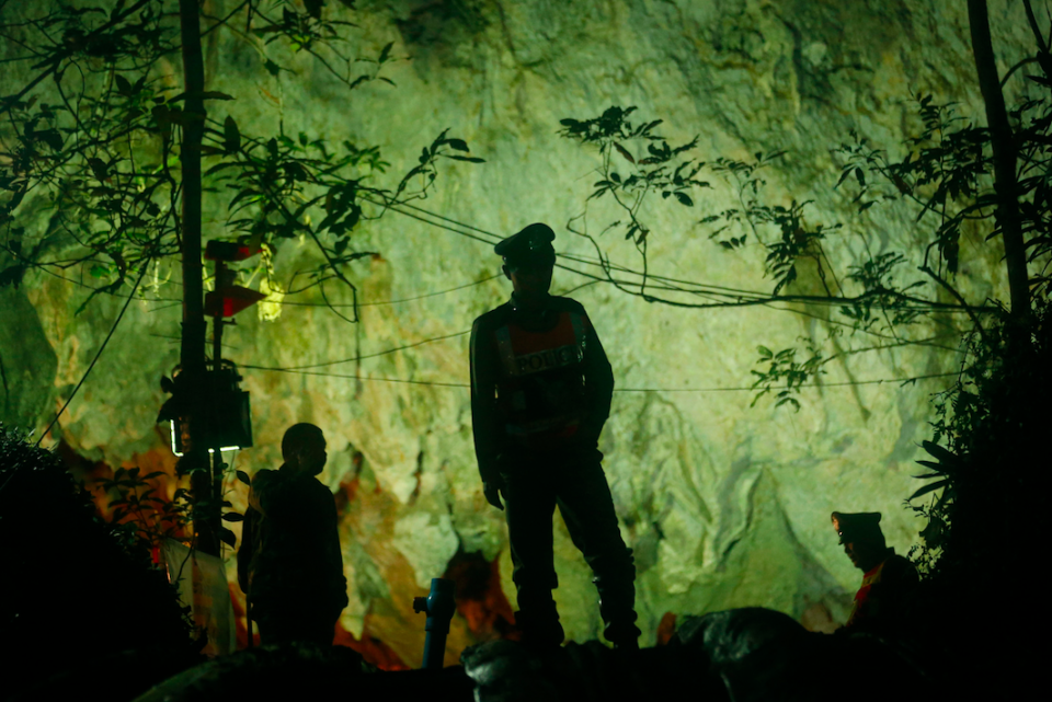 Thai police guard the entrance to the cave. (Photo: PA)