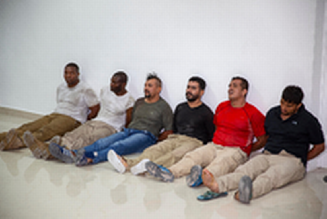 Suspects in the assassination of Haiti’s President Jovenel Moïse, among them Haitian-American citizens James Solages, left, and Joseph Vincent, second left, are shown to the media at the General Direction of the police in Port-au-Prince, Haiti, Thursday, July 8, 2021. Moïse was assassinated in an attack on his private residence early Wednesday.