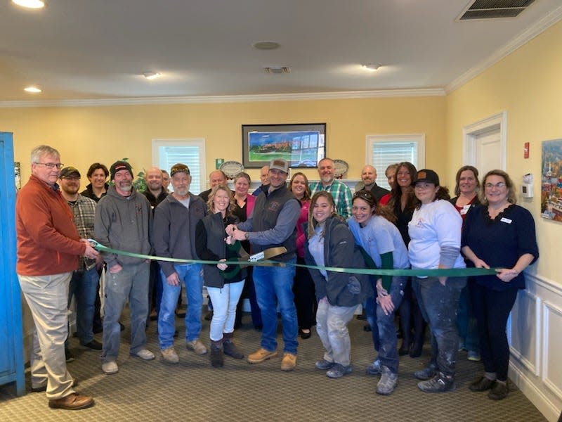 Employees from J.R. Heald Builders, LLC, join GDCC staff, Ambassadors, Board members, and local officials for their ribbon-cutting ceremony at the Chamber.