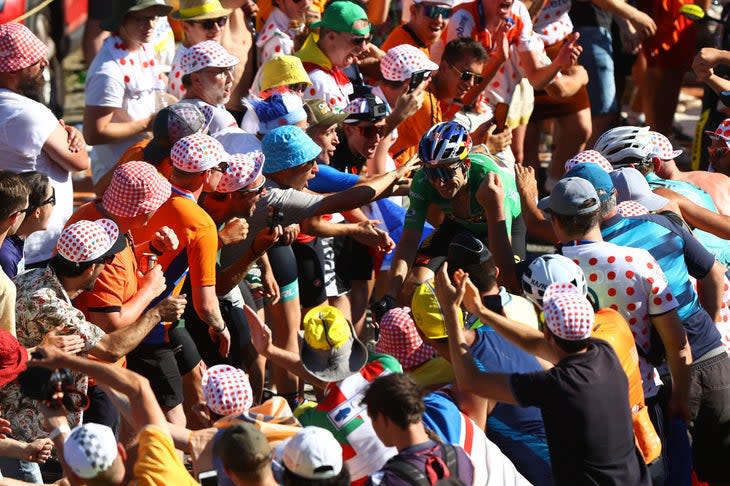 <span class="article__caption">Wout Van Aert rides through a sea of public on Alpe d’Huez.</span> (Photo: Michael Steele/Getty Images)