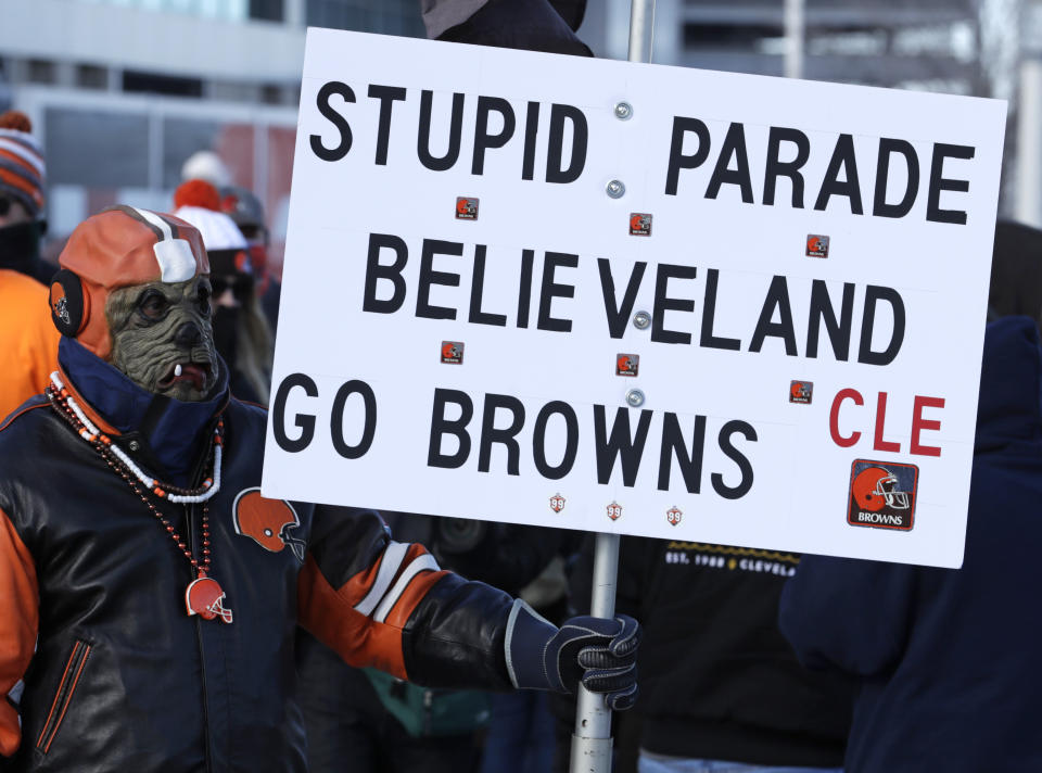 A Cleveland Browns fan watches the "Perfect Season" parade, Saturday, Jan. 6, 2018, in Cleveland. The Browns became the second team in NFL history to lose 16 games in a season. In joining the 2008 Detroit Lions in a shameful loser's club, the Browns have found a new low in what has been nearly two decades of disgrace since returning as an expansion franchise in 1999. (AP Photo/Tony Dejak)