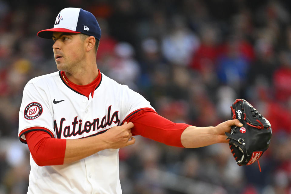 Washington Nationals starting pitcher MacKenzie Gore adjusts his sleeve between pitches during the first inning of an opening-day baseball game against the Pittsburgh Pirates at Nationals Park, Monday, April 1, 2024, in Washington. (AP Photo/John McDonnell)