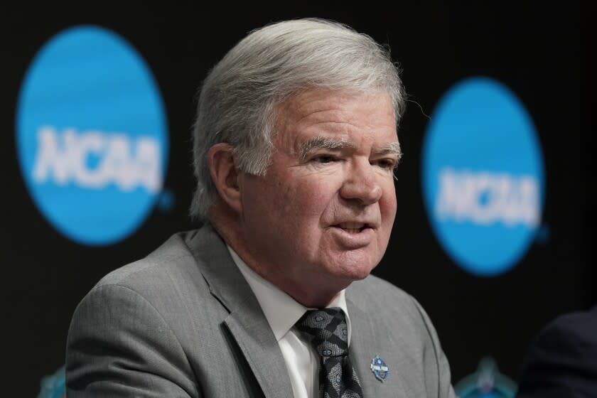 FILE - NCAA President Mark Emmert speaks at a news conference at the Target Center, site of of the Women's Final Four NCAA college basketball tournament, March 30, 2022, in Minneapolis. Emmert is stepping down after 12 years on the job. NCAA Board of Governors Chairman John DeGioia announced the move Tuesday, April 26, and said it was by mutual agreement. Emmert will continue to serve in his role until a new president is selected and in place or until June 30, 2023. (AP Photo/Eric Gay, File)